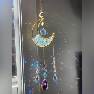 Gold Crescent Moon Suncatcher with aquamarine blue stones.